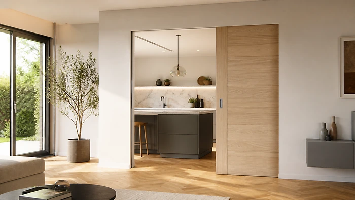 Porta scorrevole in PVC bianco a scomparsa tra soggiorno e cucina - Bisacchi